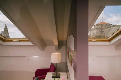a hotel room with a view of the city at Os Sobriños Do Pai in Santiago de Compostela