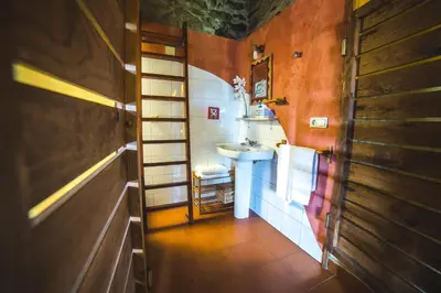 a bathroom with a sink and a ladder in it at Caserío da Castiñeira in Sas do Monte