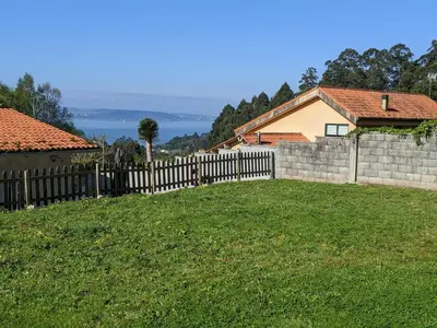 a fence in a yard next to a house at Casa Cabanas in Cabañas