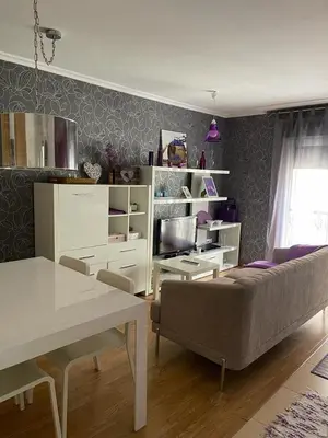 a living room with a couch and a table at Península de la paz in Lugo