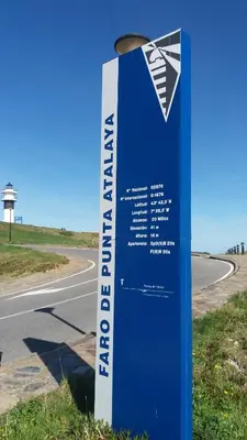 a blue and white sign on the side of a road at Península de la paz in Lugo
