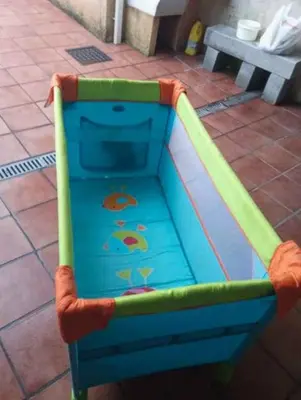 a childs play area with a slide on a sidewalk at Península de la paz in Lugo