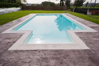 a swimming pool in the middle of a yard at Casa O Real in Boimorto