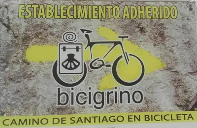 a sign with a bike and a cell phone at PortoSantiago in Portomarin