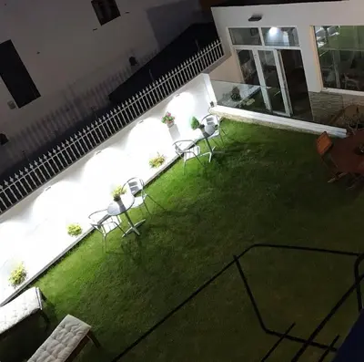 an overhead view of a yard with chairs and a lawn at PortoSantiago in Portomarin