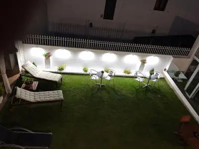 an overhead view of a living room with chairs and lights at PortoSantiago in Portomarin