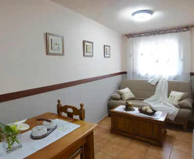 a living room with a couch and a table at Casa Samuel in Navia