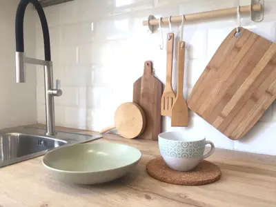 a kitchen counter with a bowl and a cup on a coaster at Joya en Orense Centro in Ourense