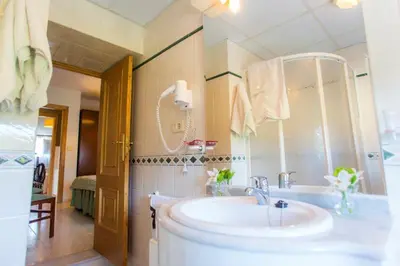a bathroom with a sink and a mirror at Casa BRAIS in Barreiros