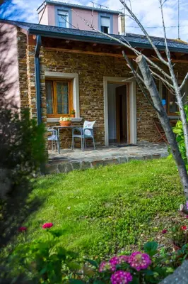 a house with a table and chairs in a yard at Casa BRAIS in Barreiros