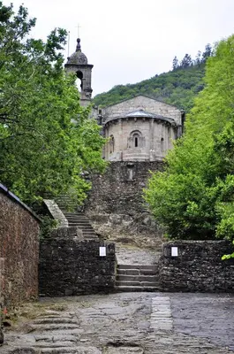 an old stone building on a hill with stairs at Alvarella in Villarmayor