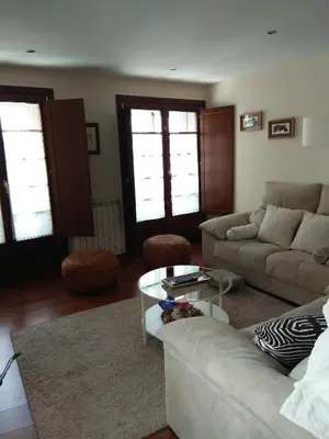 a living room with a couch and a table at Apartamento Cine Colón in Ribadeo