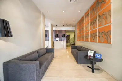 a living room with two couches and a table at Carris Cardenal Quevedo in Ourense