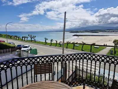 a balcony with a view of the beach at Apartamento Foz Playa in Foz