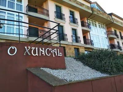 a sign in front of a building at Alojamientos Barreiros 3000 in Barreiros