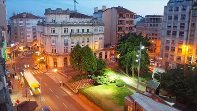 a view of a city street with buildings at night at Hostal Mafer in Santiago de Compostela