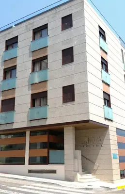 a building with noaa written on the side of it at Isla Nova Hotel in Foz