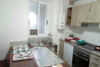 a kitchen with a counter top and a sink at Hospedaje Mendez in Lugo