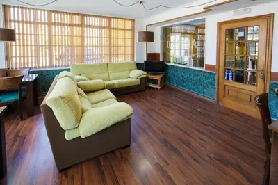 a living room with a couch and a table at As Areas II in Viveiro