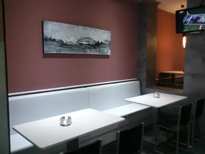 a bathroom with two white sinks in a restaurant at Hostal Fisterra in Lugo