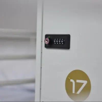 a close up of a door with a remote control on it at Augas Quentes Hostel in Ourense