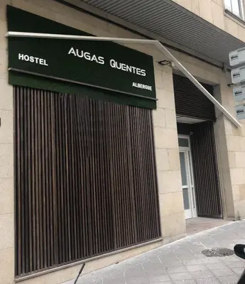 a hospital building with a sign on the front of it at Augas Quentes Hostel in Ourense