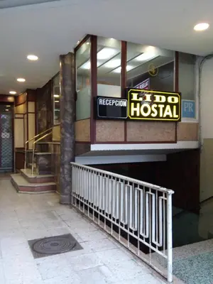 a hospital building with a sign on the side of it at Hostal Lido in Ourense