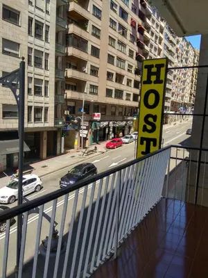 a balcony with a view of a city street at Hostal Lido in Ourense