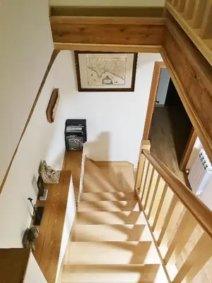 a staircase in a house with a picture on the wall at Casa Blanquita in Molinaseca