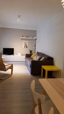 a living room with a couch and a table at AdA Apartamento in Santiago de Compostela