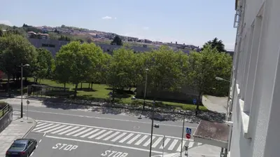 a view from a window of a street with trees at AdA Apartamento in Santiago de Compostela