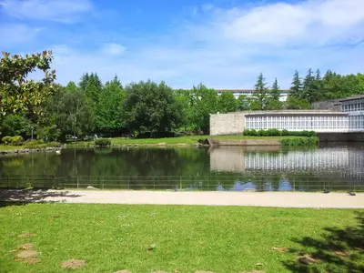 a body of water with a building in the background at AdA Apartamento in Santiago de Compostela