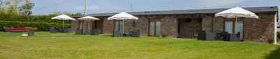 a row of umbrellas in front of a building at Villas Las Catedrales in Ribadeo