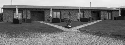 a building with a bunch of speakers in front of it at Villas Las Catedrales in Ribadeo