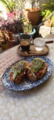 a blue and white plate with food on a table at Hostal Pension Artilleiro in Santiago de Compostela