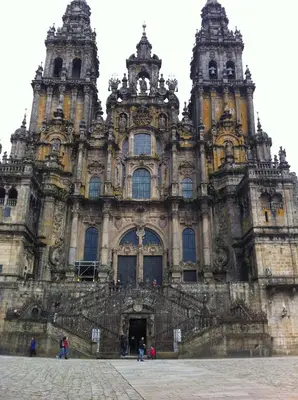 a large building with people standing in front of it at Hostal O Patron in Santiago de Compostela