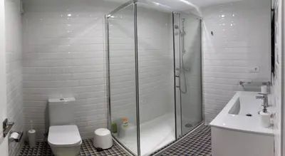 a bathroom with a shower and a toilet and a sink at Puerta del Camino in Santiago de Compostela