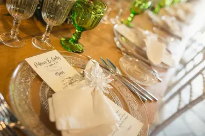 a table topped with glasses and plates with napkins at Casa de Amancio in Lavacolla