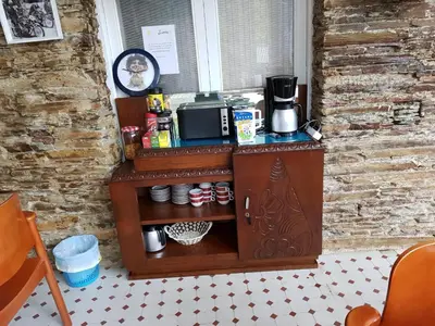 a kitchen with a counter with a coffee maker at Albergue Savior in Lourenzá