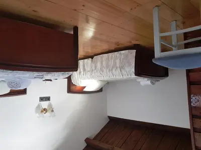 a room with two bunk beds and a tv at Albergue Savior in Lourenzá