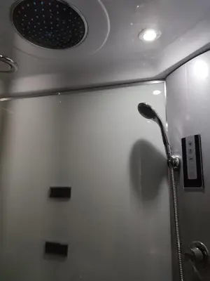 a shower in a bathroom with a shower head at Albergue Savior in Lourenzá