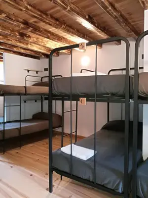 a group of bunk beds in a room at Albergue Savior in Lourenzá
