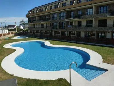 a large swimming pool in front of a building at Precioso Apartamento con Spa en Galicia / Playa Catedrales in Foz