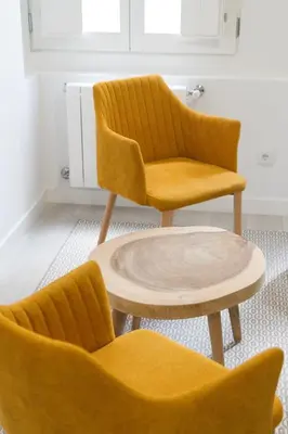 two chairs and a coffee table in a room at Santiago Center Rooms in Santiago de Compostela