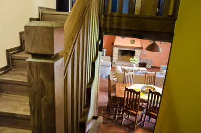a view of a dining room with a table and chairs at Naturlar Casa Teillor in Moldes