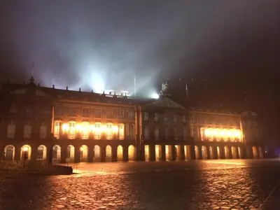 a large building at night with lights on at Hotel Fonte de San Roque in Santiago de Compostela
