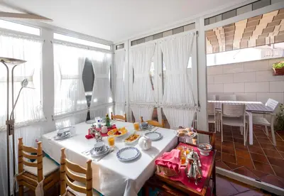 a dining room with a table with food on it at El Descanso de Wendy in Astorga
