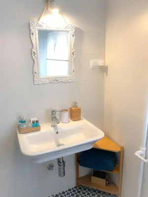 a bathroom with a sink and a mirror at Pensión Fernández in Vega de Valcarce