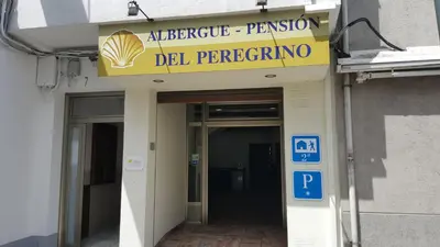 an entrance to a building with a sign on it at Del Peregrino in Arzúa