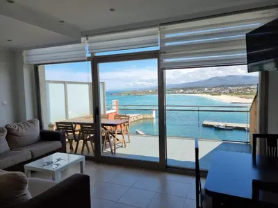a living room with a view of the ocean at Mirador al Cantabrico in Foz